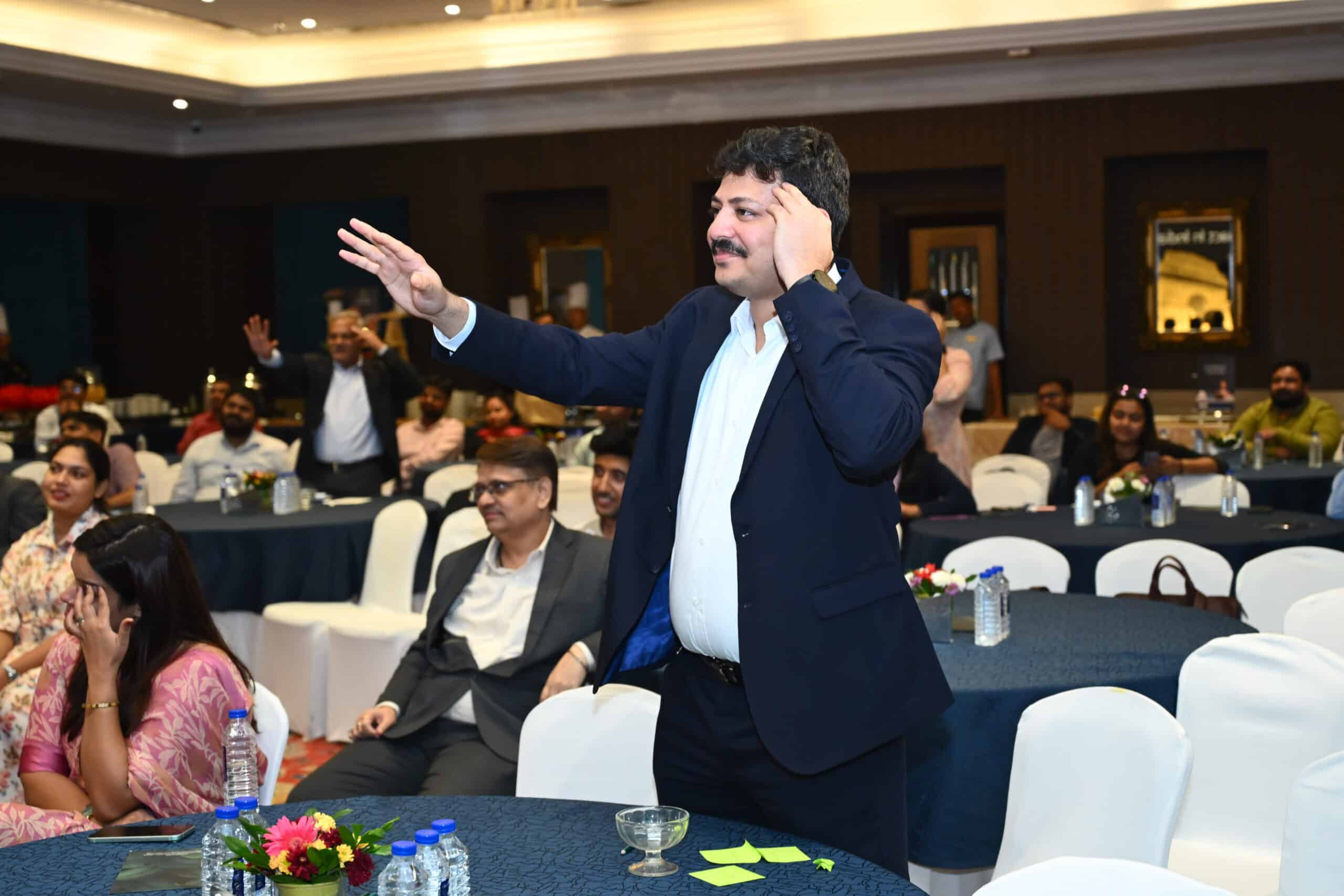 Corporate Mentalist has a Participant assist during a show