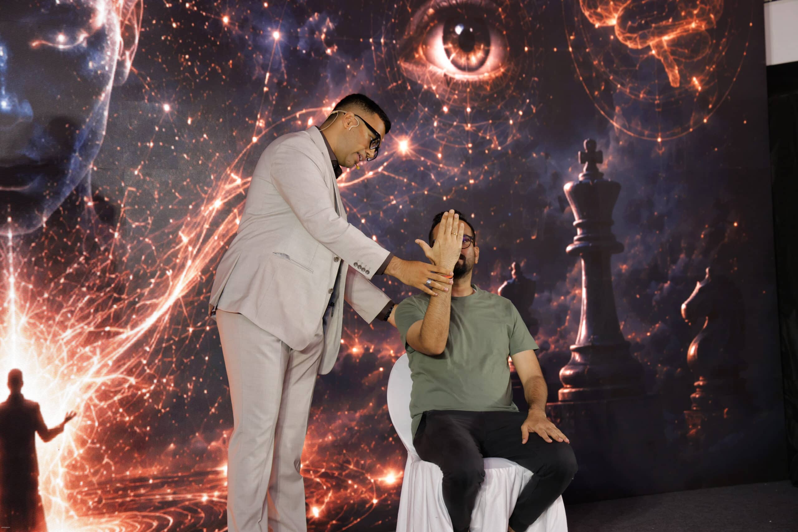 A Participant being Hypnotised during a Corporate Mentalist Performance in Mumbai